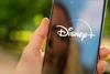 Disney+ on mobile phone ( Alexander Kirch shutterstock)