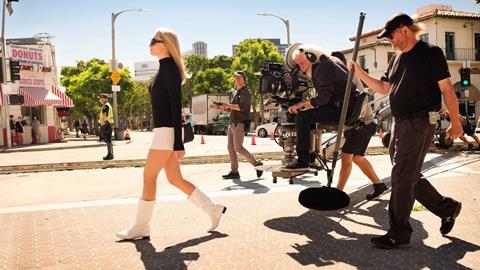 Once Upon A Time in Hollywood Robert Robertson and Margot Robbie 16x9 credit Sony Pictures