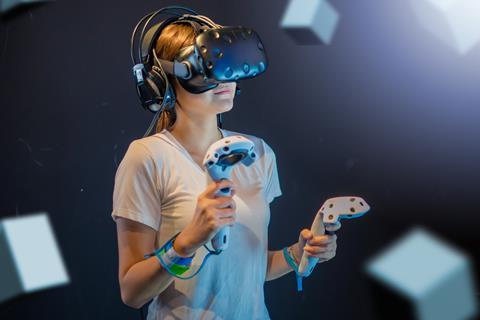 young woman using VR console gaming set