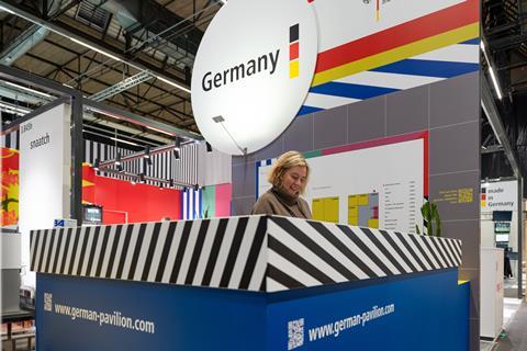 D1 German pavilion Smile behind desk