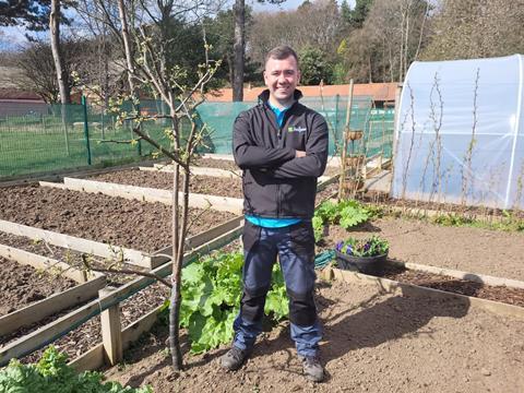 Calum Clunie in recycled plastic jacket over sustainable polo at his allotment in Leven in Fife. 