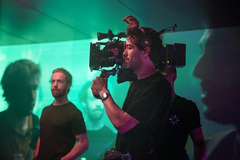 Cinematographer Paul Guilhaume working on the set of Emilia Pérez